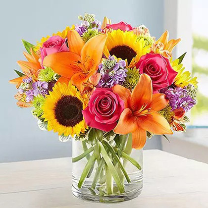 Vivid Bunch Of Flowers In Glass Vase